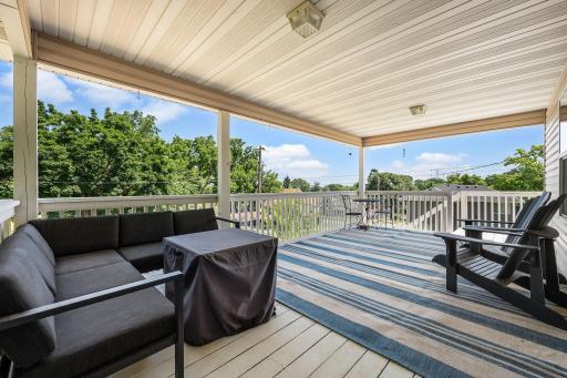 Live among the treetops with views of St. Paul. MASSIVE front porch that feels extra private being elevated. 54 Belvidere St E, St. Paul, MN 55107