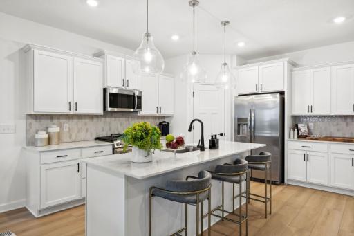 (Photo of model home, finishes will vary) A corner pantry provides plenty of storage space for culinary essentials