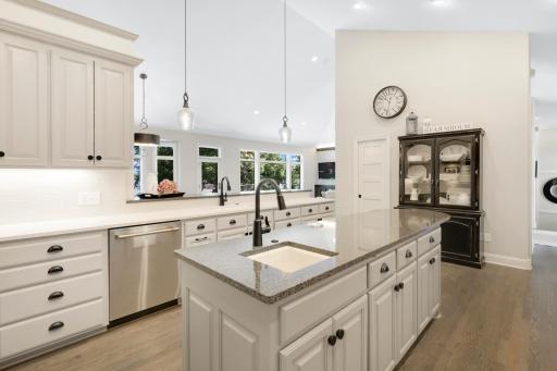 Large center island with vegetable sink, pop up outlet and phone charger