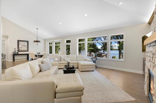 Full wall of windows and volume ceilings make the best of the views to the lake