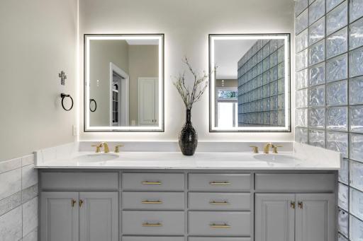 Dual vanity with double LED back lit mirrors with adjustable light effects.