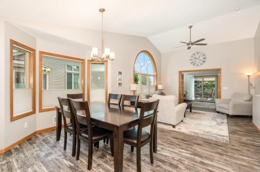 The dining area features: bay window (2020) & a vaulted ceiling. Updated: flooring, paint and chandelier (all in 2022). The seating area can be expanded towards the foyer, allowing you to host large family events on special occasions & holidays.