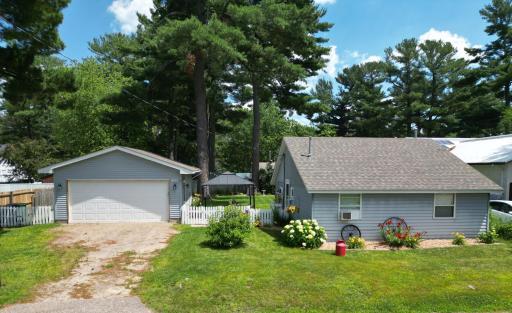 Well Manicured Yard, 2 car heated garage, patio in between home and garage.