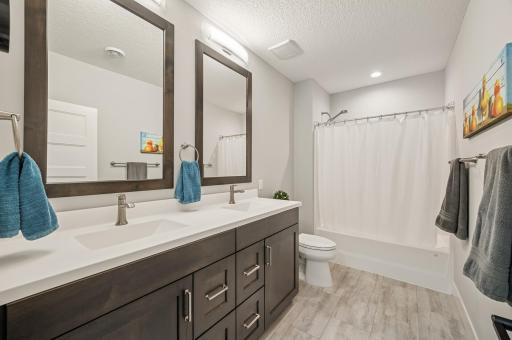 Lower level full bath with dual sinks and 39" counters