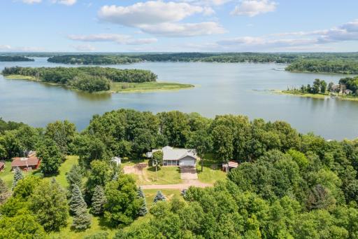 Charming rambler nestled on 1.17 acres with deeded access to Rush Lake. Features include a welcoming covered porch, attached 2-car garage, and peaceful wooded surroundings—ideal for year-round lake living.