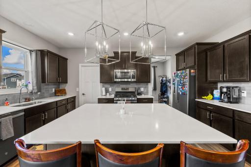 Kitchen with a walk-in pantry, stainless steel appliances and a massive center island!