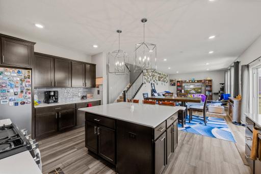 Kitchen / dining / family room great room with hardwood floors.