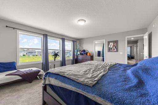Primary bedroom has full bathroom, walk-in closet and nature preserve views.
