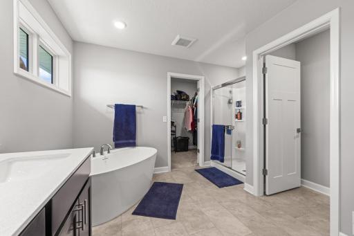 Primary bathroom has separate tub and shower and 'dual sinks'.