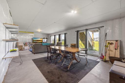 Unfinished walkout lower level has a sliding glass door leading to 12' x 20' patio with 1' border stained gray.