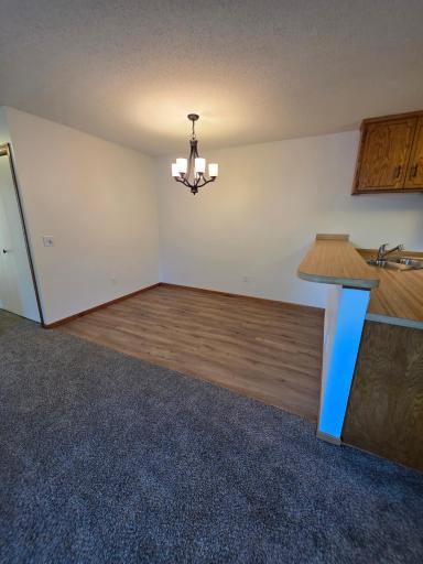 Dining Room Has New Paint, Floor & Lighting.. Also Has A Breakfast Bar Area