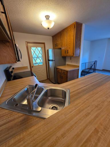 Kitchen Has A New Stainless Sink... There Is A Little Deck Off Of The Kitchen