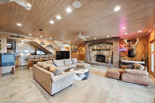 Just off the walk-out lower-level living room, a full kitchen with bar seating offers the ideal setup for lakeside entertaining and hosting guests with ease.