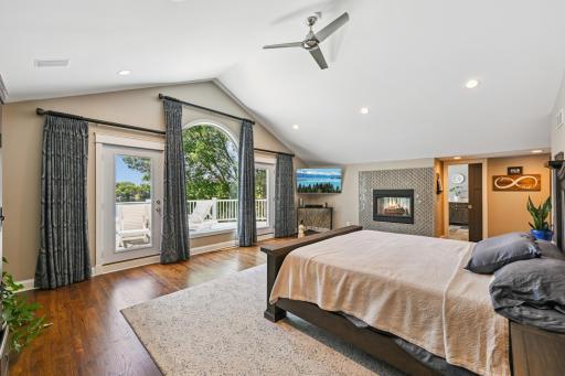 This one-of-a-kind ownerâs suite features stunning lake views, a cozy two-sided gas fireplace, and a spacious walk-through closet with ample storage for every season Minnesota brings.