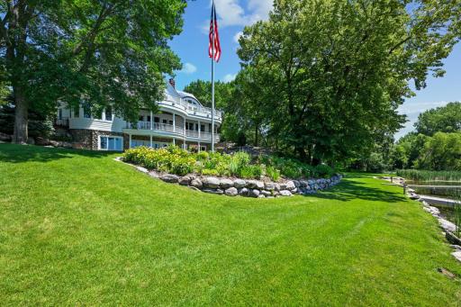 A grand American flag waves proudly over this exceptional lakeshore estate, where timeless architecture meets manicured grounds and a gently sloping lawn to the waterâs edge. Celebrate lake living on the grand shores of West Lake Sylvia in Annandale.