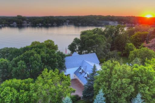 This Southwest facing shoreline offers panoramic evening views as the sun dips below the tree line, casting golden reflections across the water an idyllic backdrop for peaceful lakeside living less than an hour from the Twin Cities.