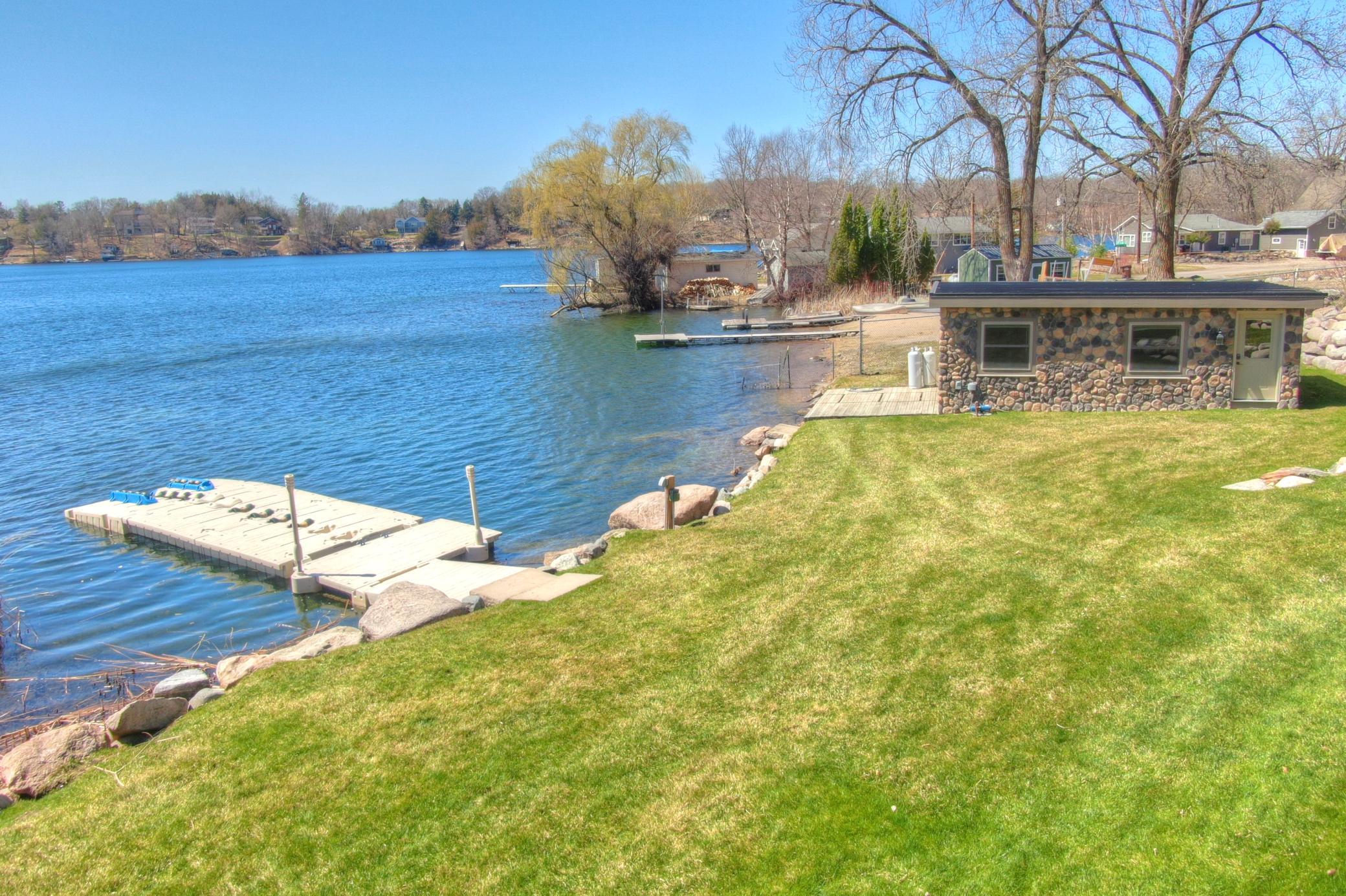 Built in 2019 the boathouse offers convenient storage for lake gear just steps from the shoreline with easy access to the dock, this structure enhances the functionality and appeal of this exceptional property.