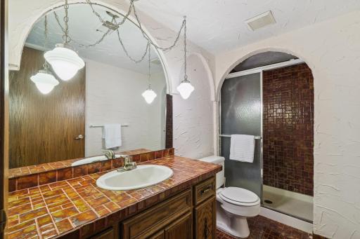 Lower level bathroom conveniently to 3 lower level bedrooms