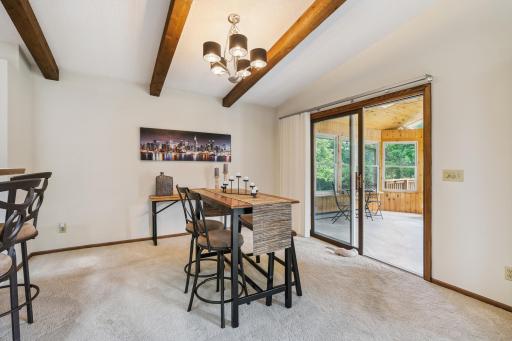 Dining area opens to 4 seasons porch and backyard