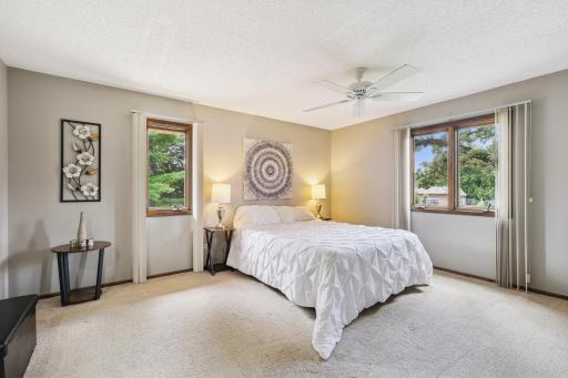 Primary bedroom with walk in closet and private bathroom with shower.