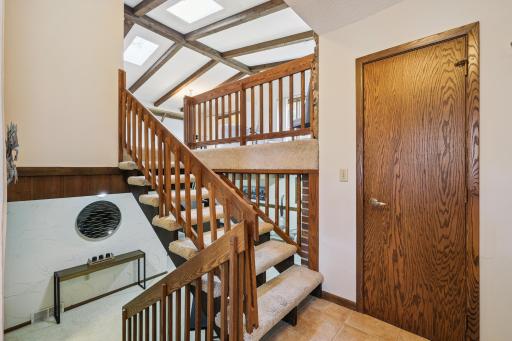 Ceramic foyer with open stairway to upper and lower levels. Walk in coat closet.