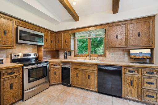 Kitchen has wonderful counter space and lots of storage.