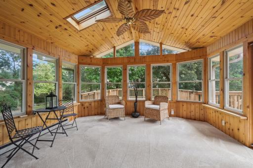 4 season porch with tongue and groove ceiling overlooks backyard.