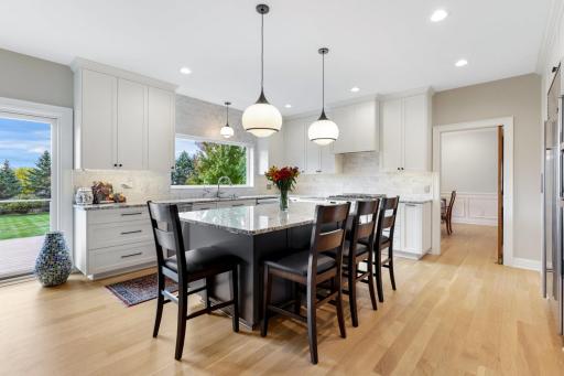 Renovated in 2022, the kitchen boasts all-new cabinetry, blending timeless design with modern functionality. New JennAir dishwasher and ice makerâstrategically placed to the left of the sink enhance both form and ease of everyday living.