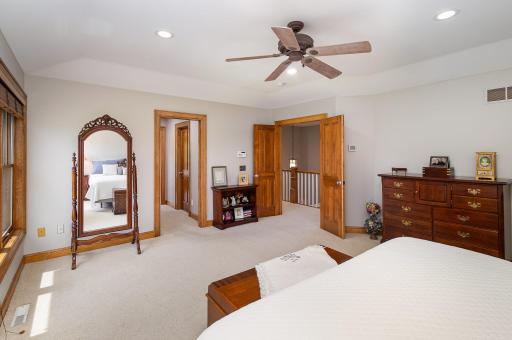 Beyond the twin walk-in closets, step into the generously sized en suite bathroomâan elegant retreat awaits. Just outside in the hallway, a second laundry area adds a layer of everyday convenience, perfectly placed to serve the upper level.