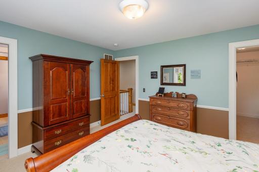 The fourth bedroom features a spacious walk-in closet for ample storage. Also, located between the primary and fourth bedrooms, there is a secondary laundry area which adds a touch of everyday luxury and convenience to the homeâs functional design.
