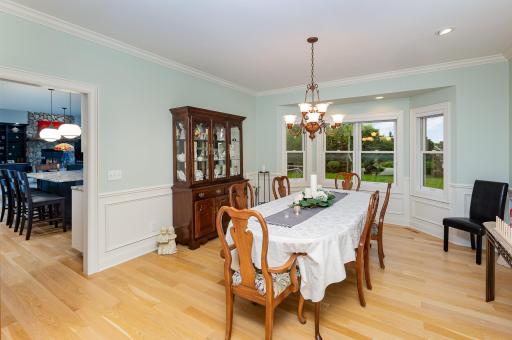 The open and spacious formal dining room faces south and highlights gleaming hardwood floors. Seamlessly connected to the gourmet kitchen, it offers the perfect setting for both intimate dinners and lively gatherings.
