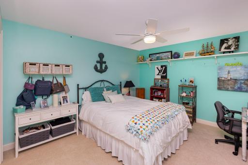 The spacious second bedroom offers comfort and versatility, featuring a south-facing window that fills the room with natural light. Complete with its own en suite full bathroom combining privacy, functionality, and a bright, welcoming atmosphere.