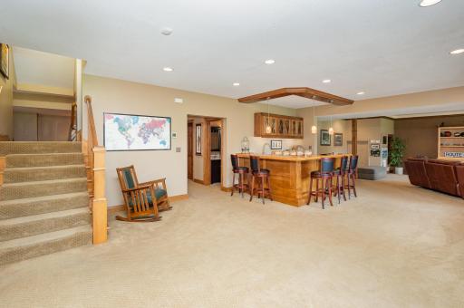 From this central vantage point, you'll find easy access to the stylish bar, the grand walkout family room, a well-appointed 3/4 bath, and much moreâblending relaxation, functionality, and effortless entertaining.