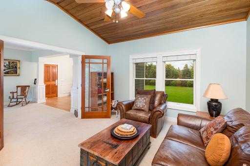 Bask in the warmth of the bright and cheerful west-facing sunroom, where golden afternoon light pours in through graceful French doorsâan inviting space for quiet reflection or vibrant conversation.