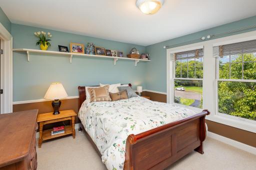 The fourth bedroom features soft northern exposure that fills the space with gentle natural light, enhancing its calm and cozy feel, and is connected via a Jack and Jill bathroom.