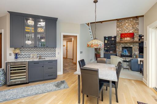 Tucked just off the informal dining area and adjacent to the family room, custom cabinetry frames a stylish beverage station complete with a built-in wine fridgeâperfectly positioned for effortless entertaining and everyday use.