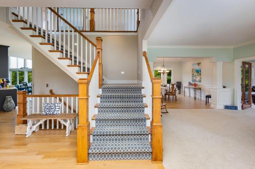 Step into a spacious and welcoming foyer where natural light pours in, accentuating the elegant open staircase that sets the tone for the homeâs grand yet inviting ambiance.
