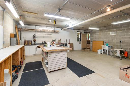 Tucked beneath the spacious three-stall garage is a remarkable 900+ sq ft flex area (26x37) with soaring 8'10" ceilings. Whether you dream of a workshop, home business, rec room, or personal dance studio, this unfinished space is full of possibility!