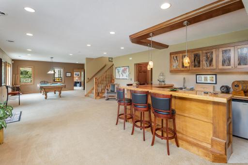This stunning maple wet bar was designed for both entertaining and everyday ease. This space pairs craftsmanship with functionalityâperfect for hosting game nights, casual gatherings, or simply enjoying a quiet moment with morning coffee.