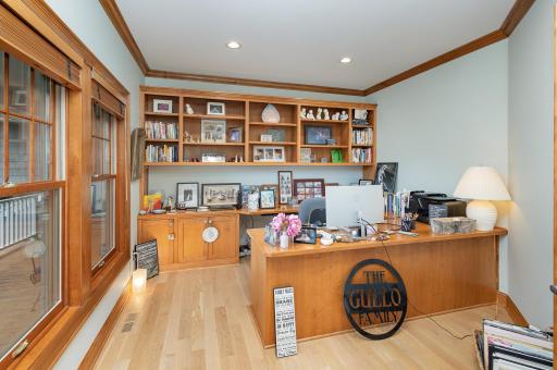 Set just off the foyer and front porch, the main level home office offers both privacy, framed by classic French doors. This versatile space welcomes natural light and creates an ideal environment for focused work or creative pursuits.