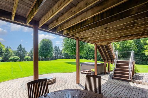 Step through the walkout patio door and onto your expansive paver patioâdesigned for relaxation and connection. A built-in firepit sets the scene for cozy evenings under the stars, while the nearby hot tub offers a serene escape.