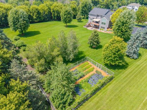 Fenced-in and irrigated garden! (36x62) filled with perennials: golden raspberries, strawberries, asparagus, chives, rhubarb, as well as pear/apple trees and room to plant your favorite annual vegetables like beets, tomatoes, yellow beans, and more.