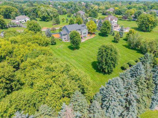 Meticulously maintained, the grounds feature lush greenery, a vibrant garden, and a full sprinkler system that keeps everything picture-perfect. Whether hosting summer gatherings or enjoying quiet morning strolls.
