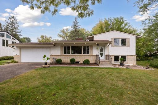 Spacious mid-century home on a large, private lot. Ready to move in and enjoy!