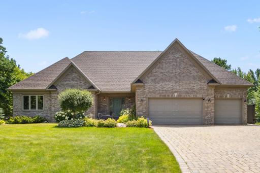 Welcome home! We'd love to have you visit - schedule your showing today! This home features a spacious layout, a brick exterior, and professional landscaping surrounding the property.