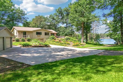 Welcome to 239 2nd street. This picturesque lake home is nestled among mature trees on a serene 1.37 acre lot.