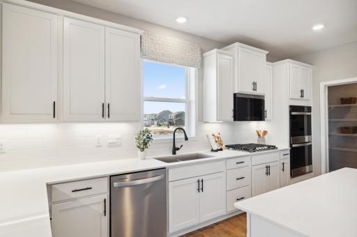Abundant cabinets and counter top spaces.