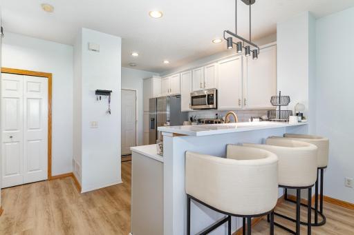 Gorgeous kitchen remodel-new lights, stainless appliances, quartz counters and extra bar height seating.