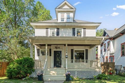 Front exterior of home with charming porch..