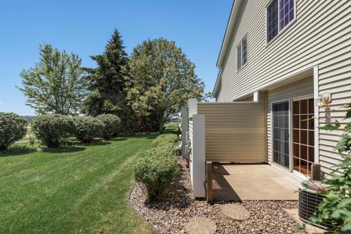 Private Patio with extra green space and only steps from walking trails!